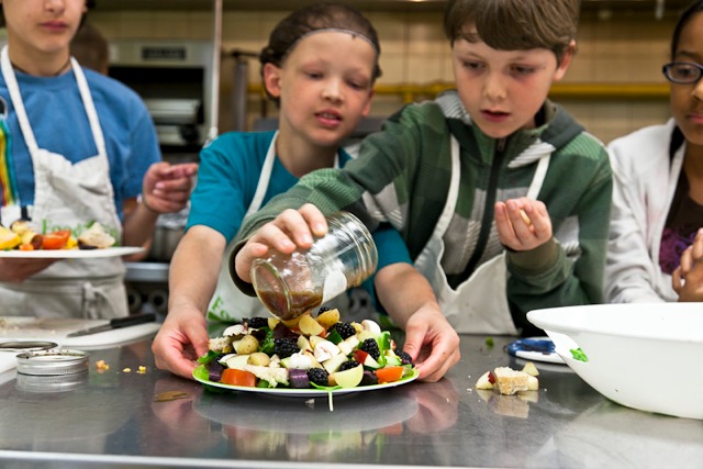 Students make signature salads in a food literacy workshop with FoodShare Toronto. Credit: Laura Berman/GreenFuse Photography.