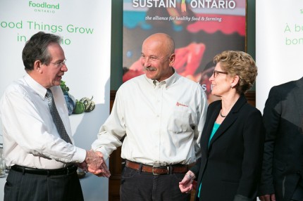 Bryan Gilvesy, Co-Chair of Sustain Ontario's Advisory Council, greets MPP Jeff Leal, Minister of Rural Affairs, and Premier Kathleen Wynne, Minister of Agriculture and Food
